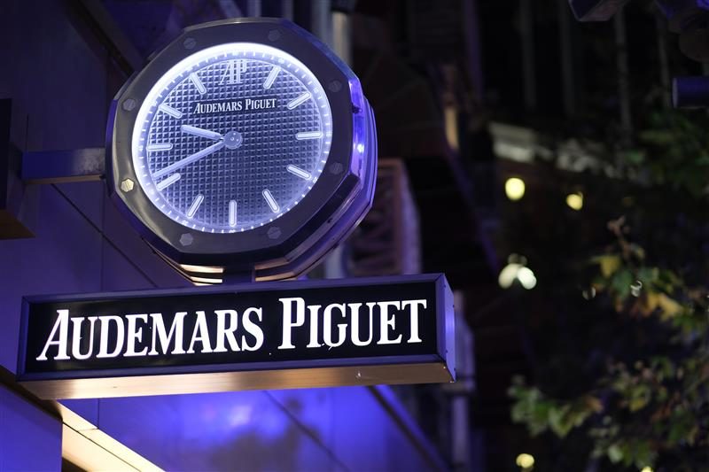 Close up Audemars Piguet store sign at night.