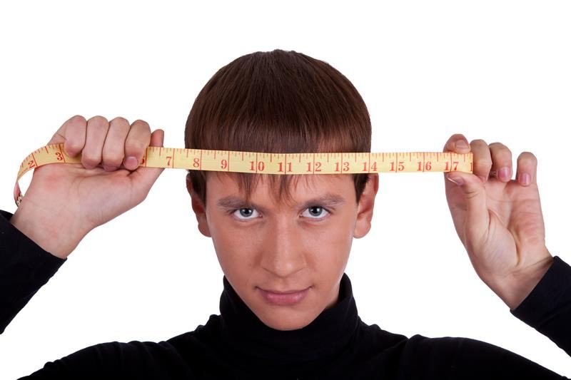 Measuring your head for the perfect hat.