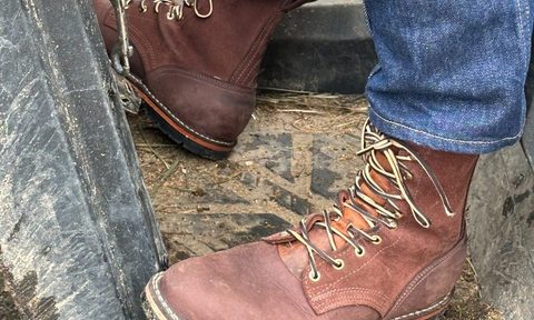 man in truck with brown boots