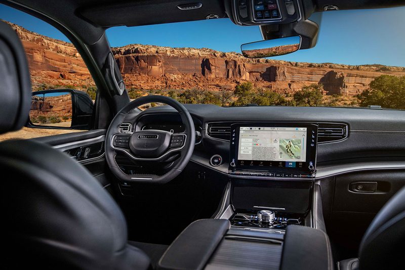 Interior of the 2025 Jeep Wagoneer Overland Special Edition SUV with the desert in the background.