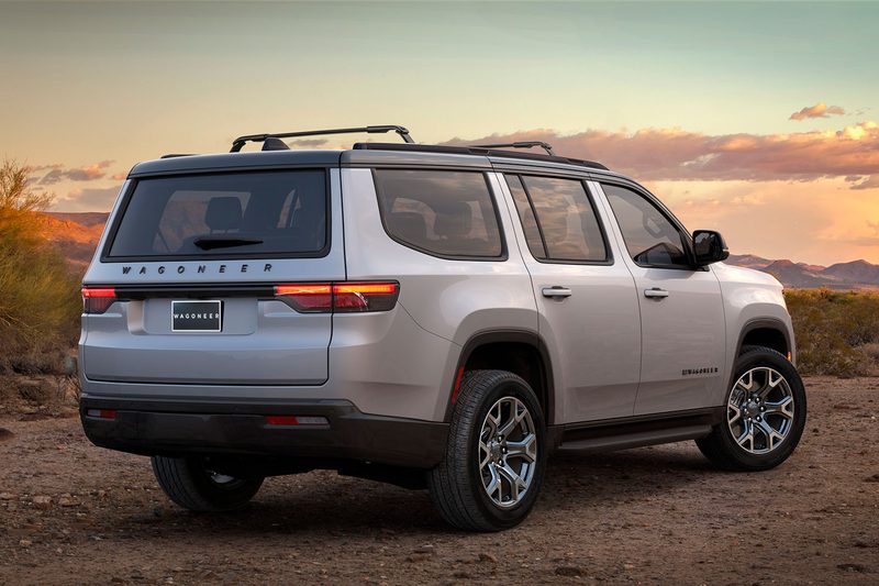 Rear three-quarter view of a 2025 Jeep Wagoneer Overland parked in the desert.