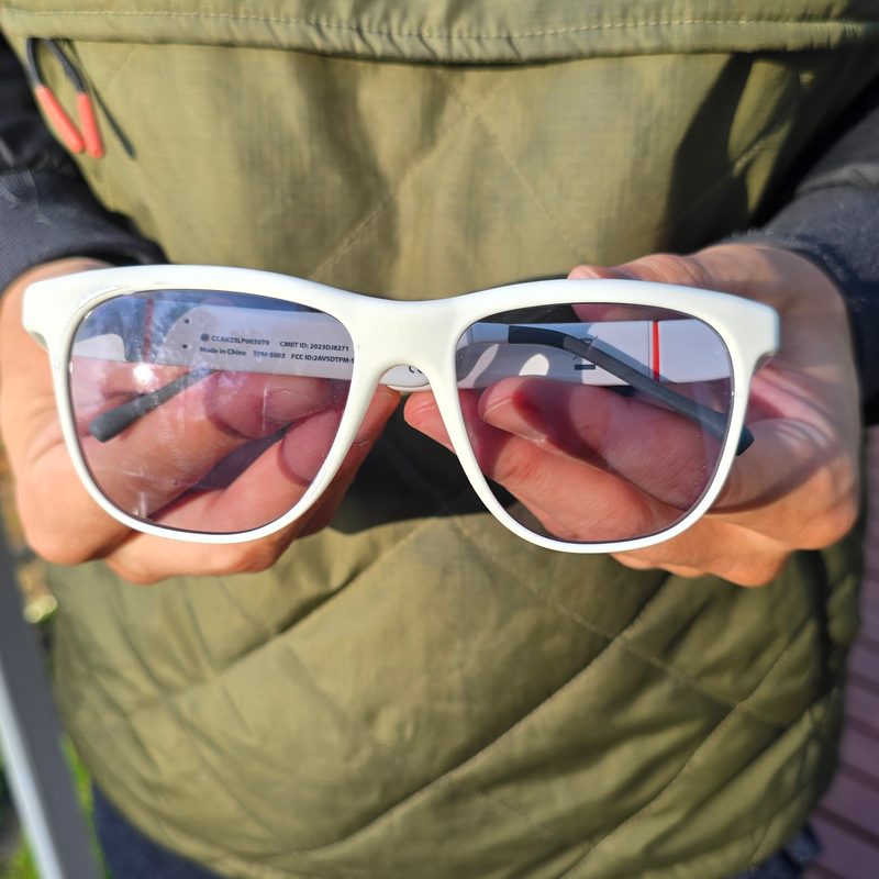 A man holding solos glasses