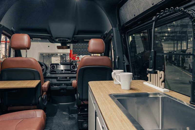 Luxurious front interior of 27North's Venture X campervan.