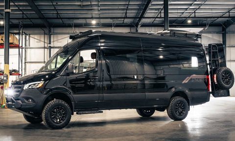 27North all-black Venture X adventure campervan parked in a garage.