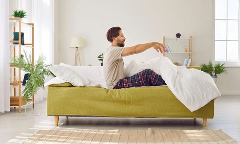 man sitting up in bed zombie sit up
