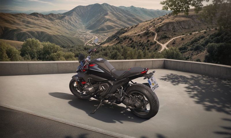 BMW R 1300 R parked on the side of the road overlooking a valley.