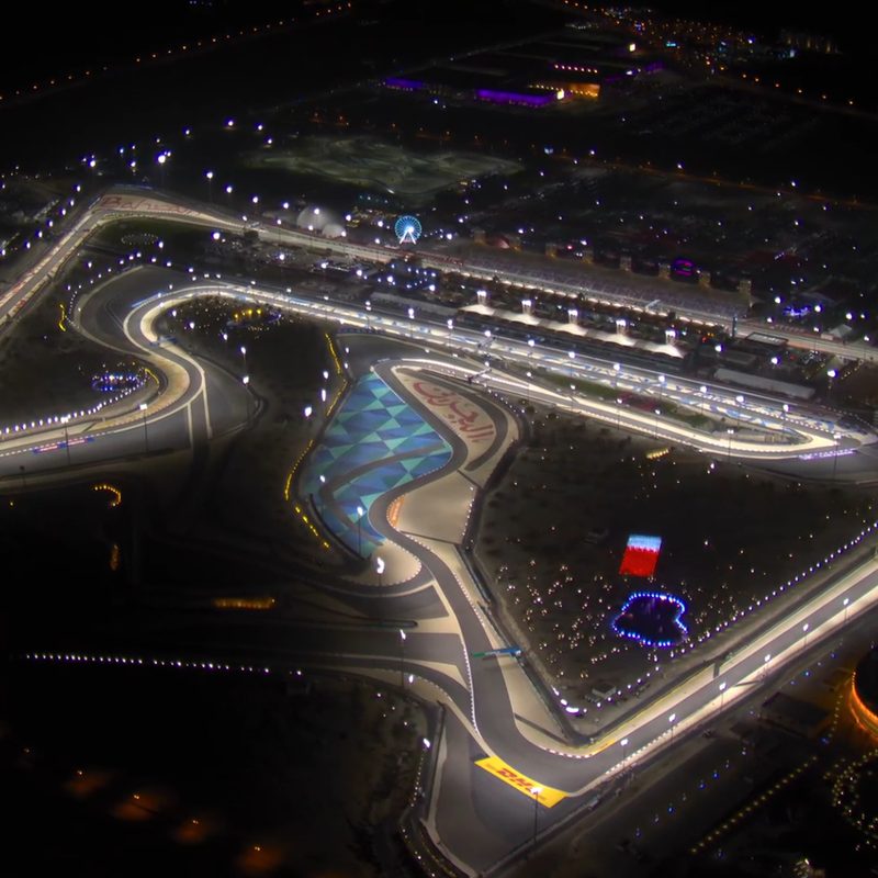 Bahrain International Circuit at night under lights for the 2025 Bahrain Grand Prix.