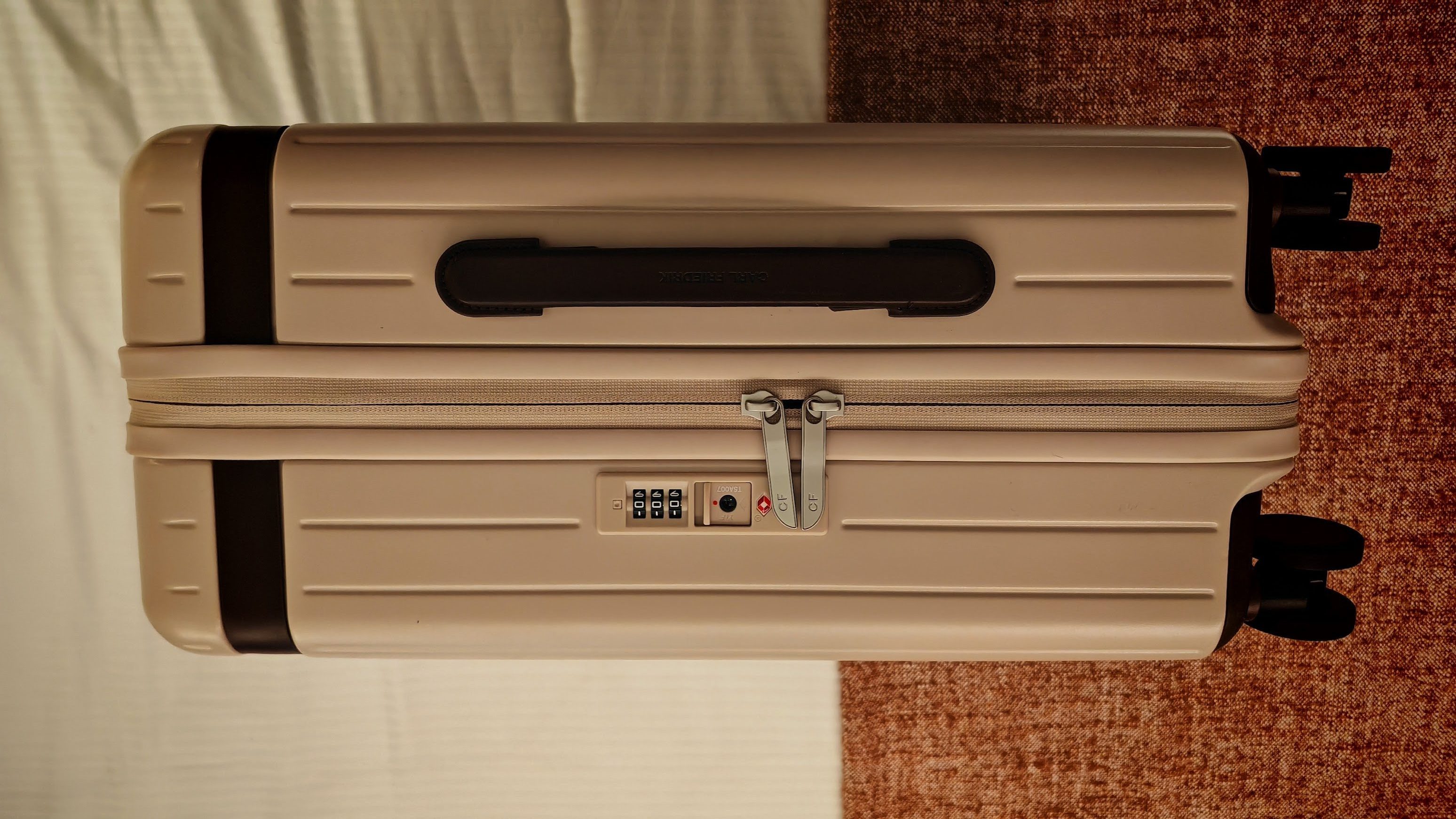 Carl Freidrick core luggage on its side