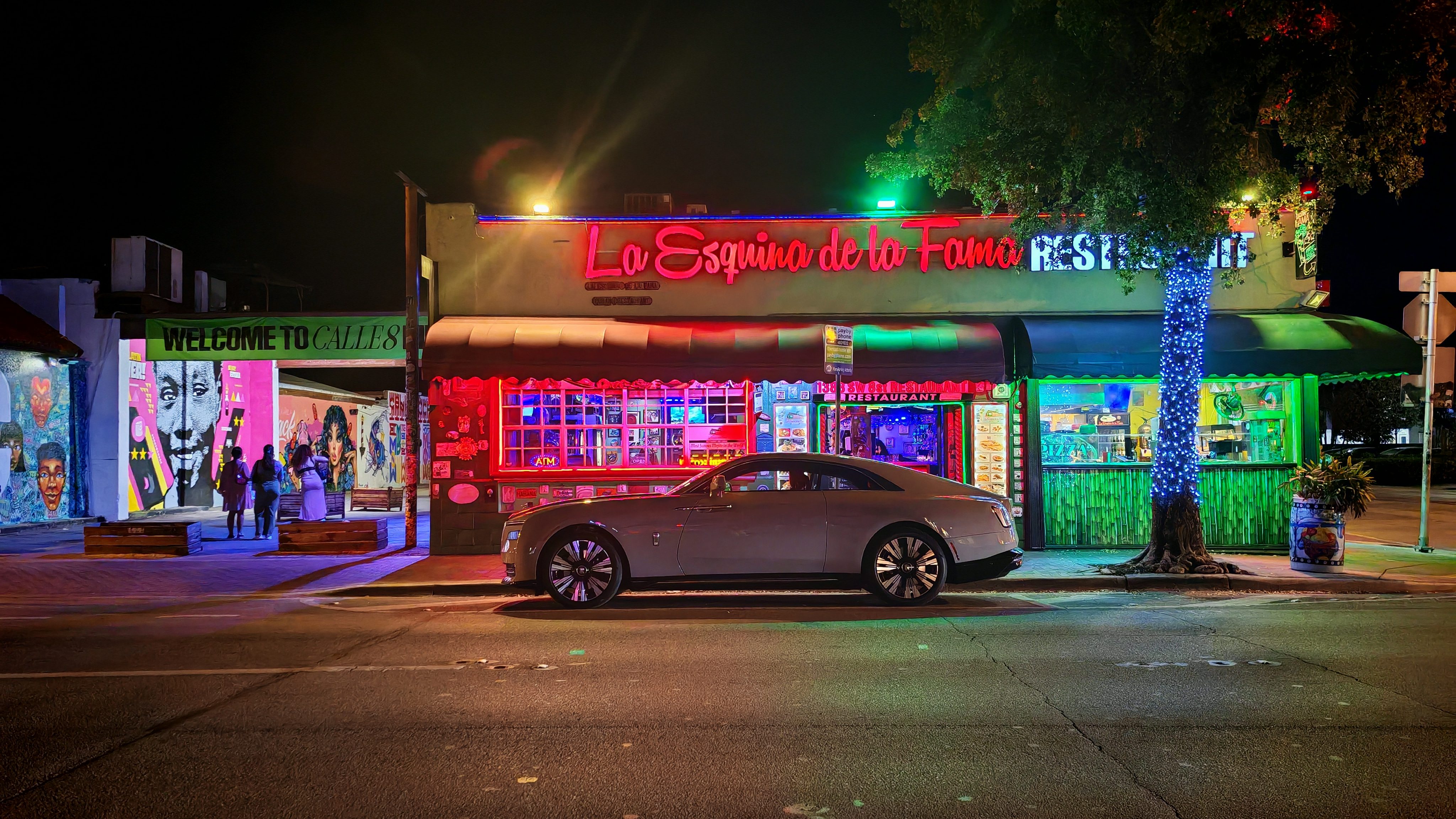 Rolls-Royce Spectre parked in front of a restaurant on Calle Ocha, Miami