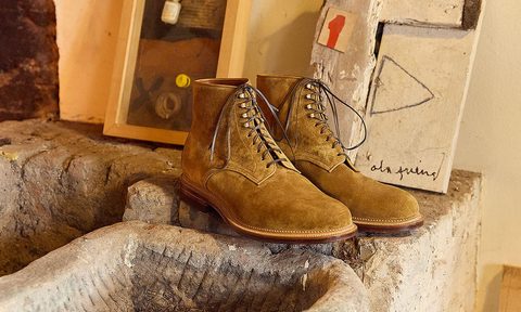 brown viberg boots on stone counters in art studio
