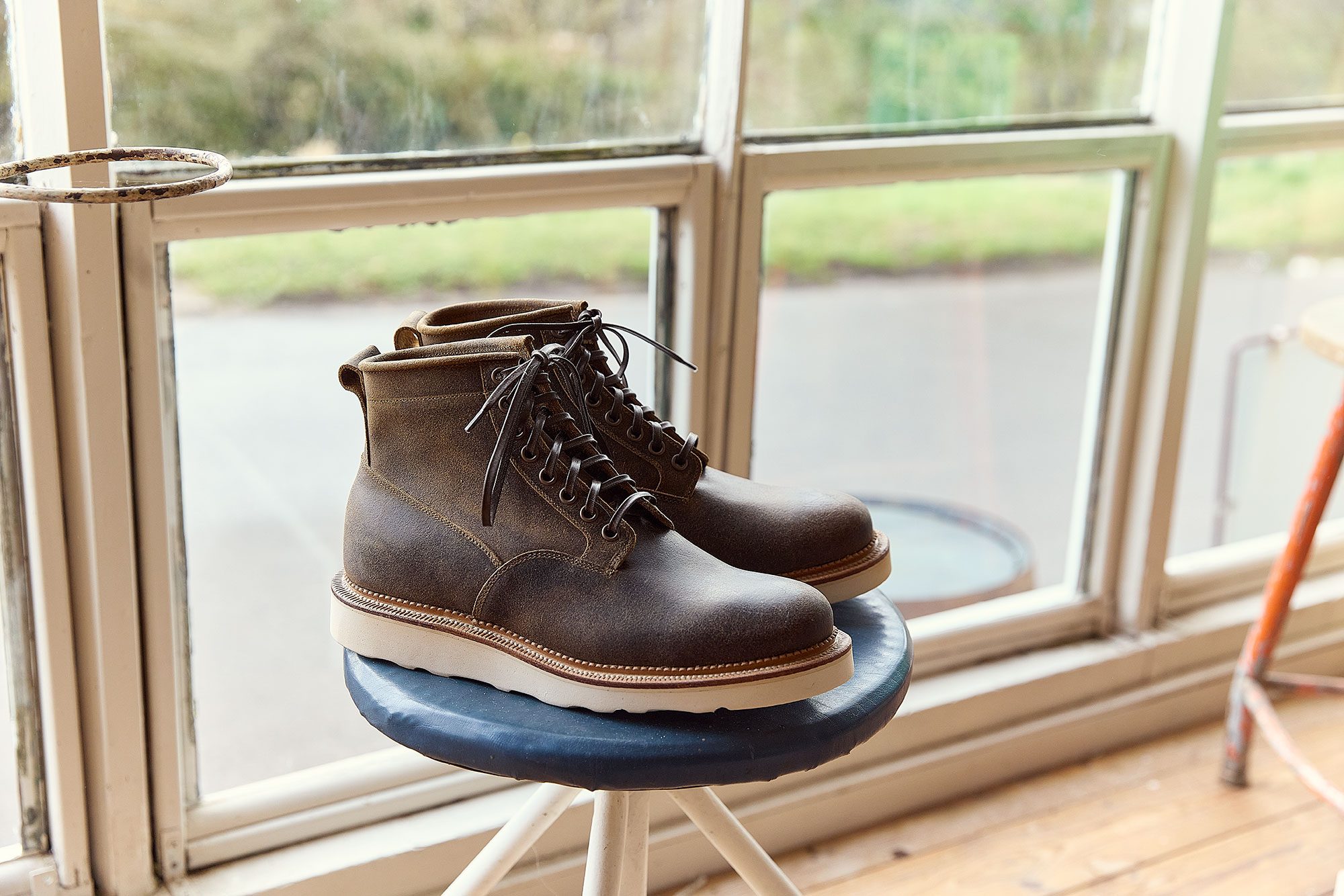 leather brown boots on stool
