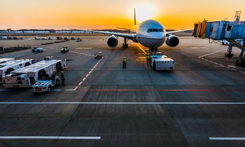 Airplane at gate sunrise