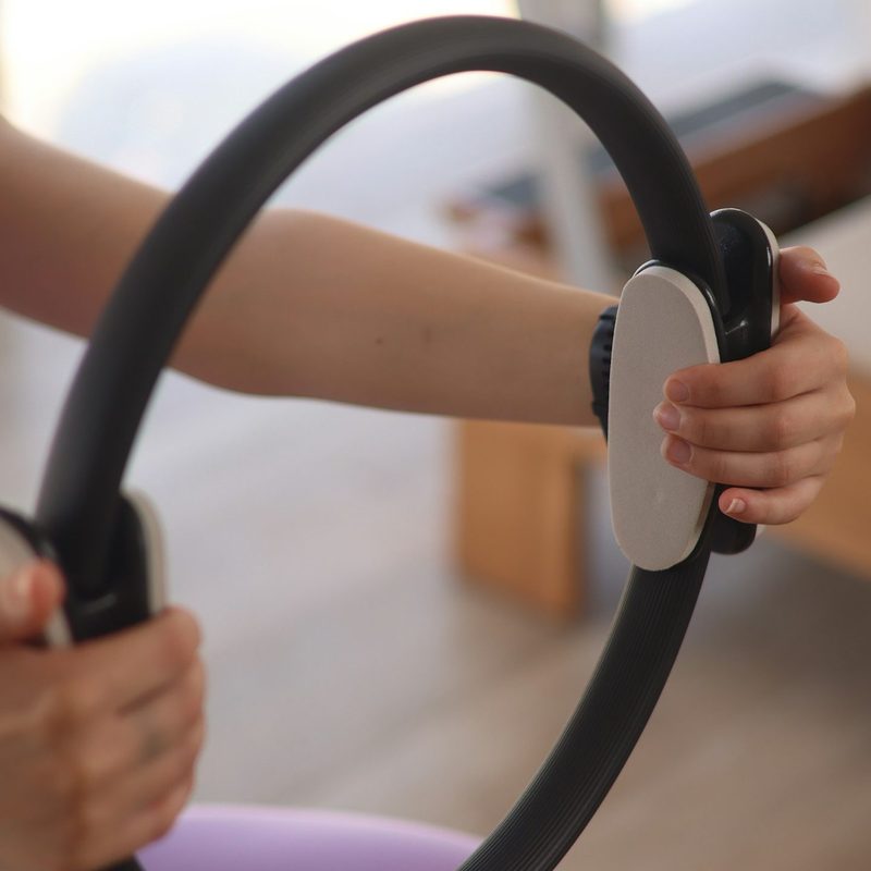 Woman holding a Pilates ring