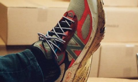 dirty new balance shoes on dessk