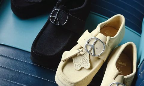 beige and black needles clarks shoes