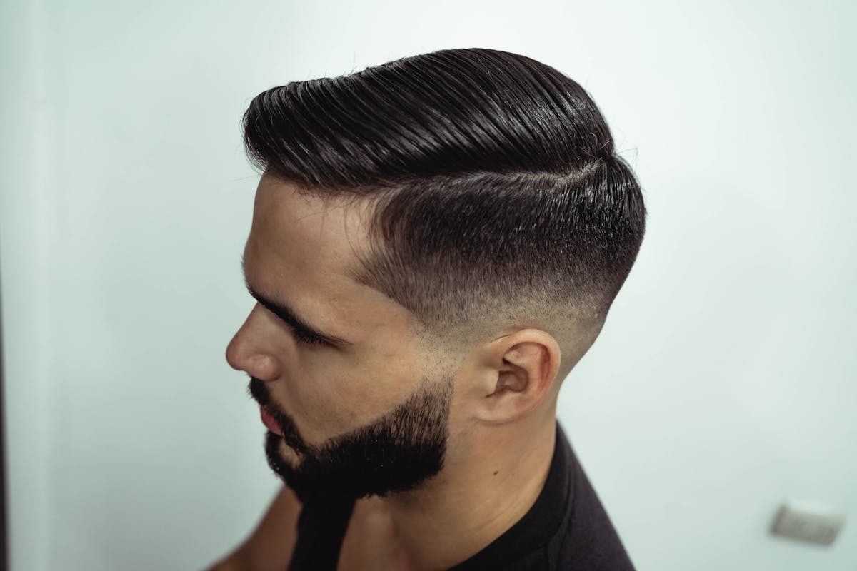 side view man at barber shop