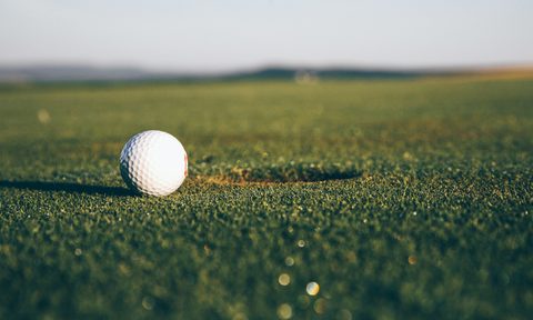 Golf ball near the hole