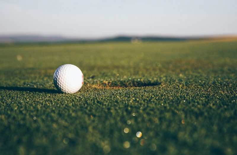Golf ball near the hole