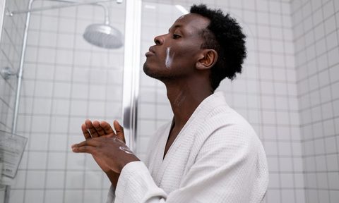 Man doing skincare bathroom