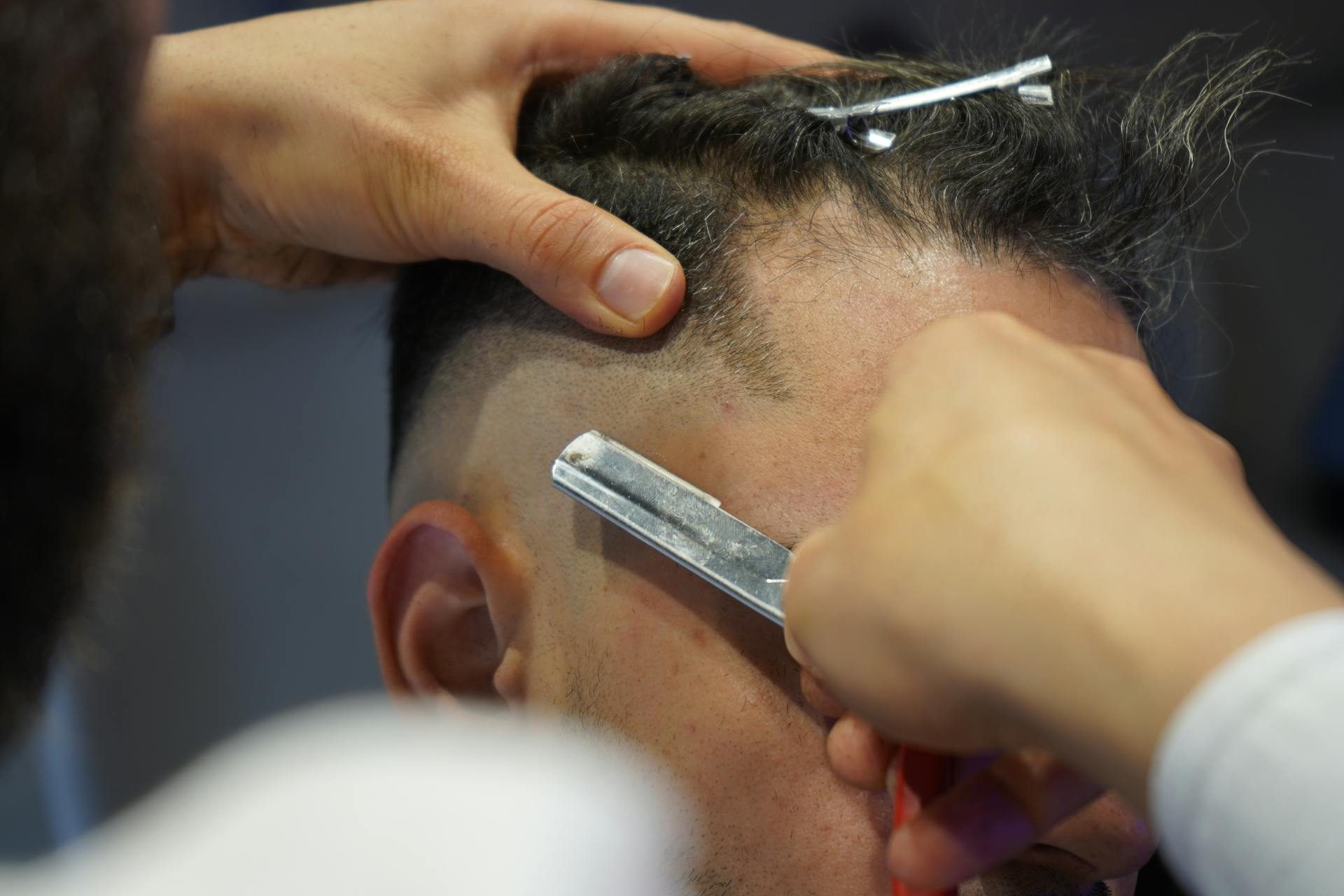 man getting a haircut razor blade