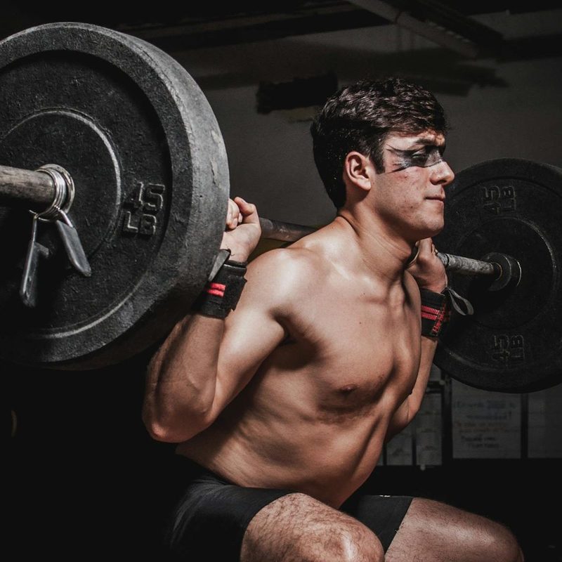 Man doing barbell back squat