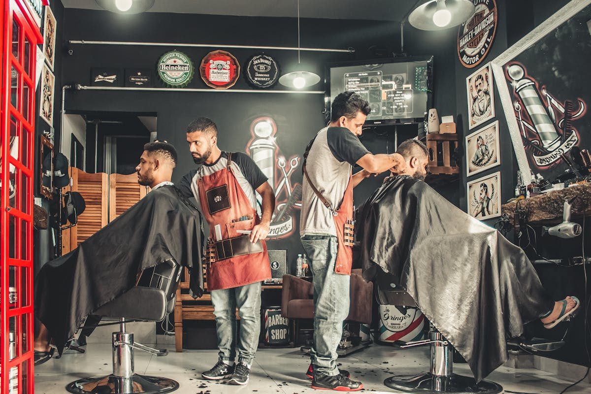 people in barber shop wide view