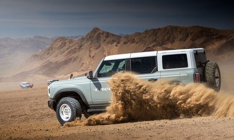 Ford Bronco driving through the desert on Pirelli Scorpion XTM all-terrain tires.