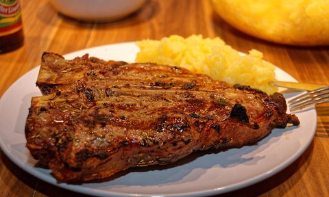 t bone steak on a plate