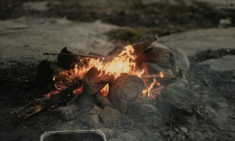 Campfire ring in a sandy area
