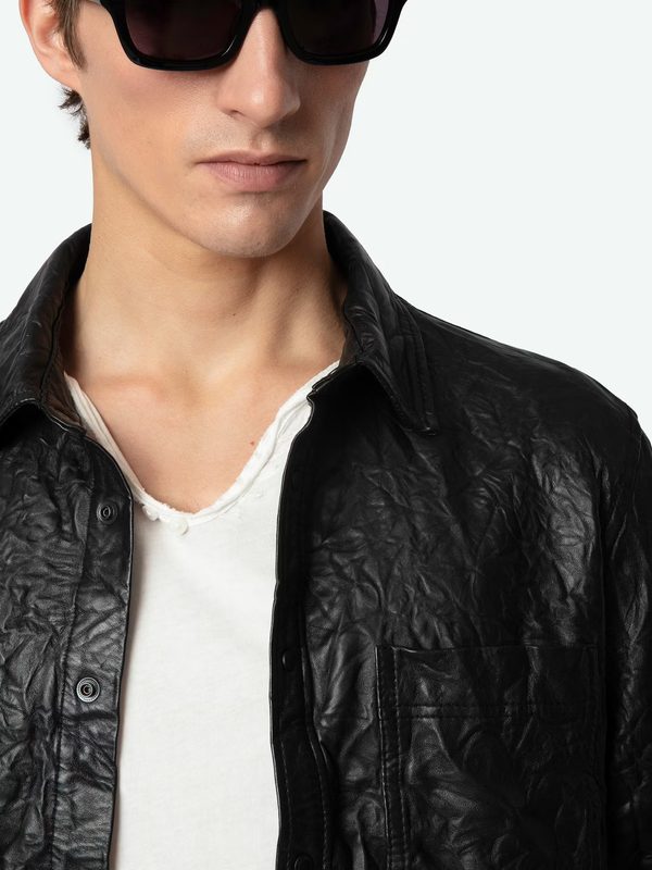 model wearing black leather jacket with black sunglasses