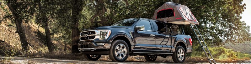 Ford truck with tent over the bed