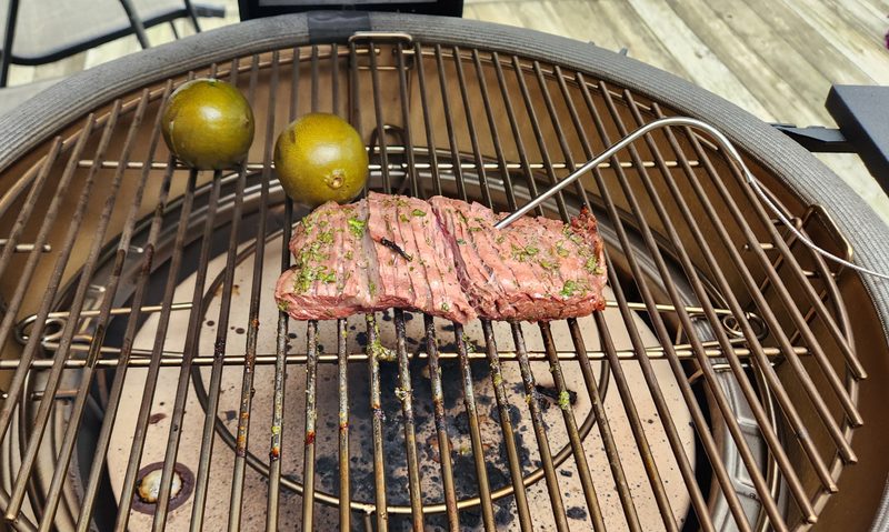 Almost done - flank steak and limes on the Kamado Joe Konnected Joe.