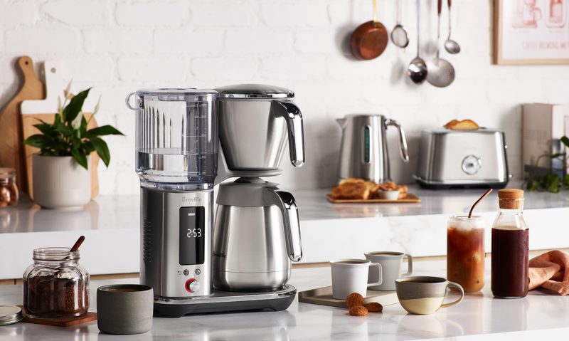 Breville Luxe Brewer with thermal carafe on a kitchen counter.