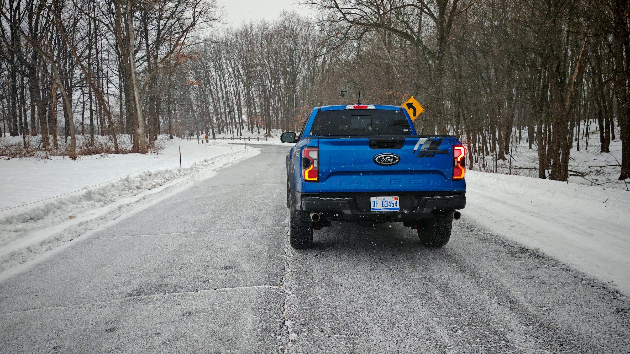 Ford Ranger Raptor rear view on a snowy road