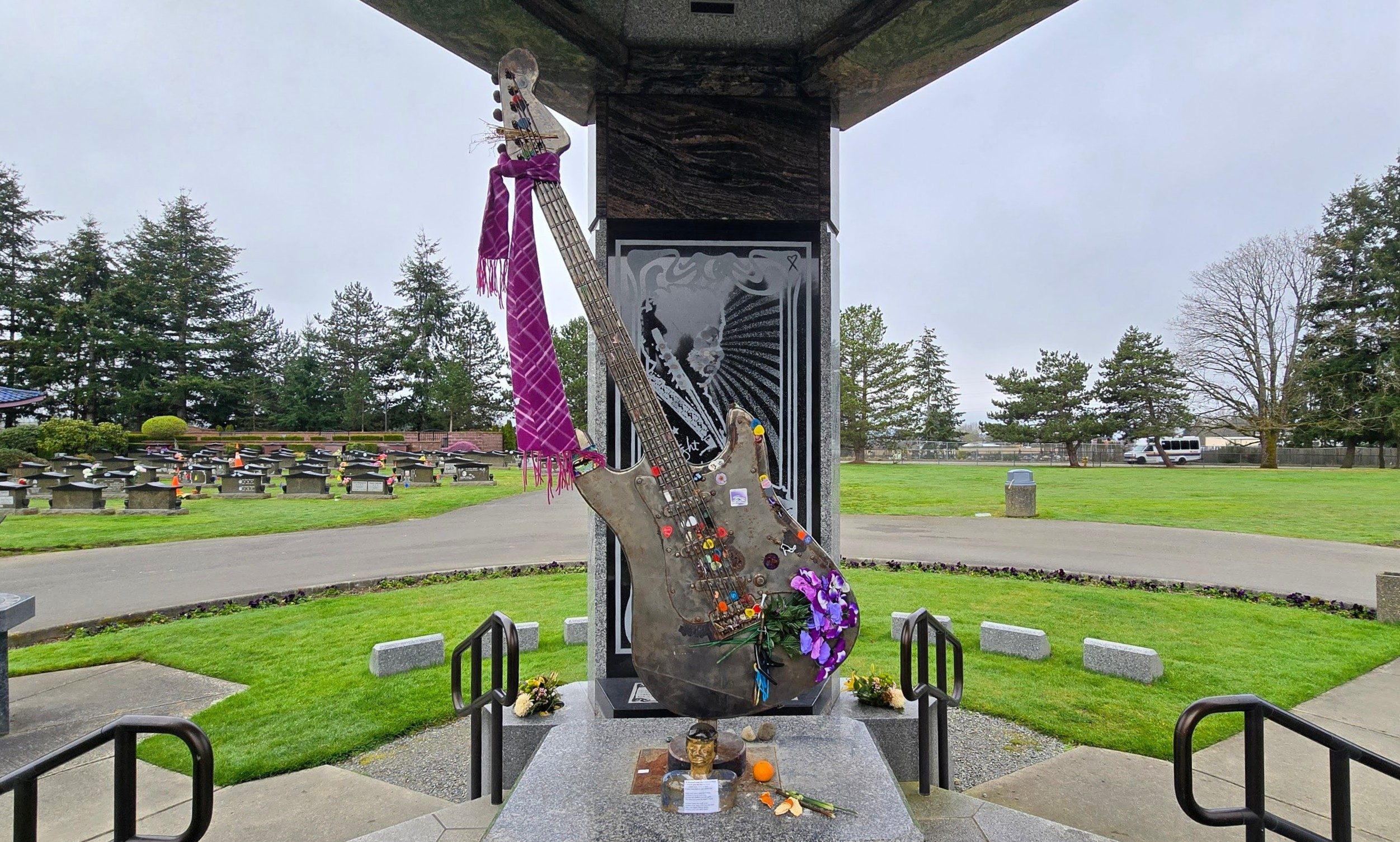 Jimi Hendrix Memorial featuring guitar adorned in offerings