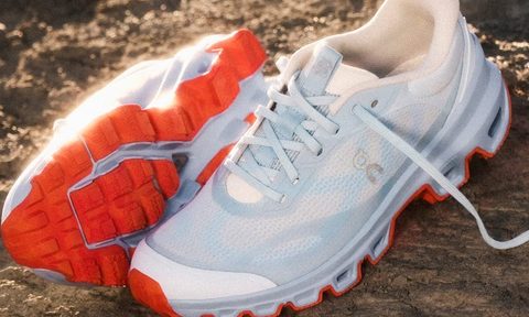 pair of loewe x on sneakers in dirt