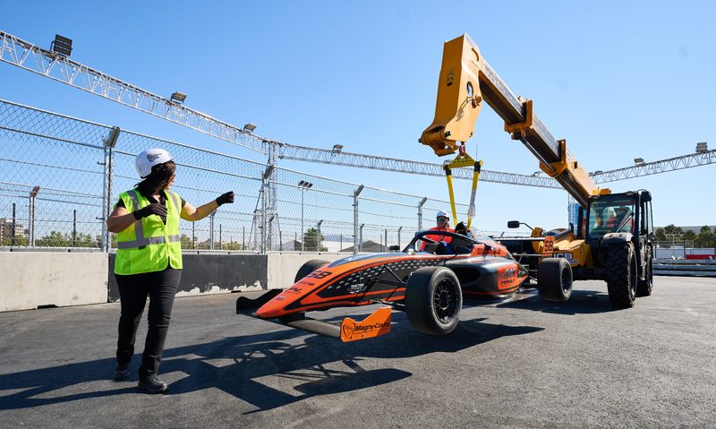 LVGP marshalls helping remove a damaged race car from the track.