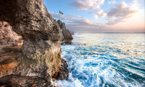 crashing waves on jamaican cliffs