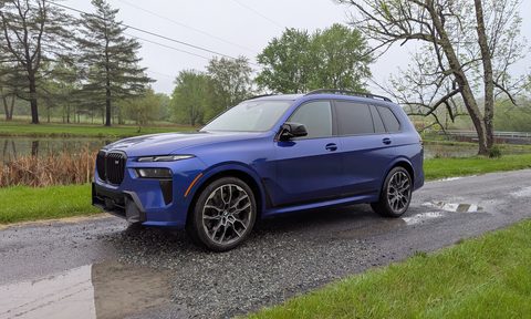 Front 3/4 view of a a blue BMW X7 M60i