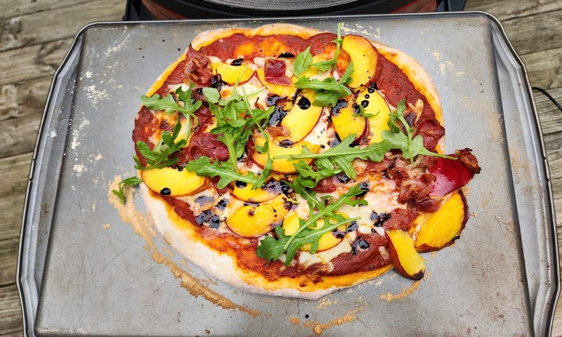 Pizza cooked in the Kamado Joe Konnected Joe Dojoe good even cooked with an inverted baking pan.