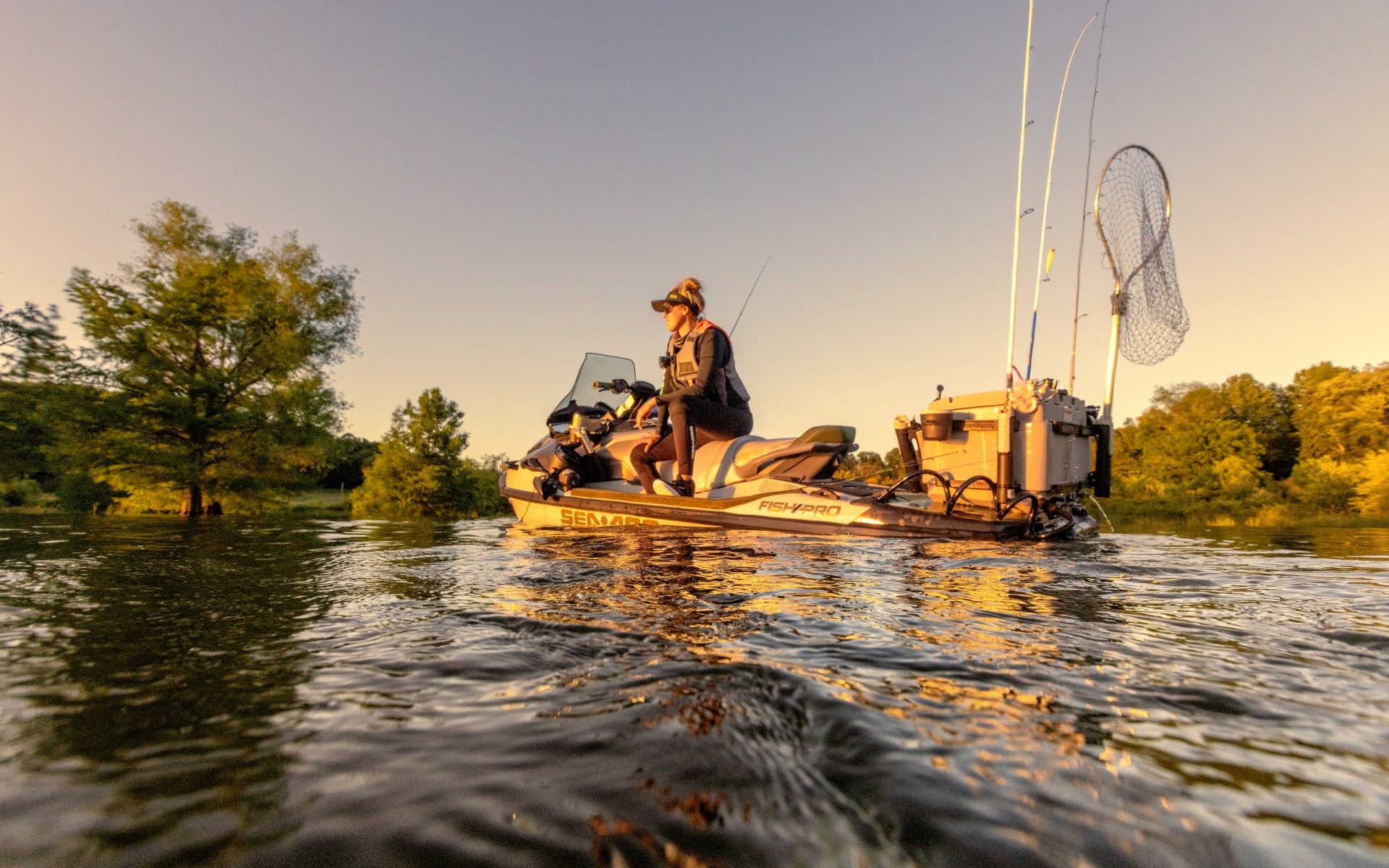 A woman fishing from a PWC