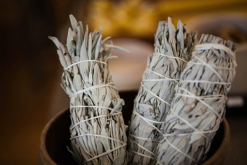 Bundles of smudging sage in a bowl