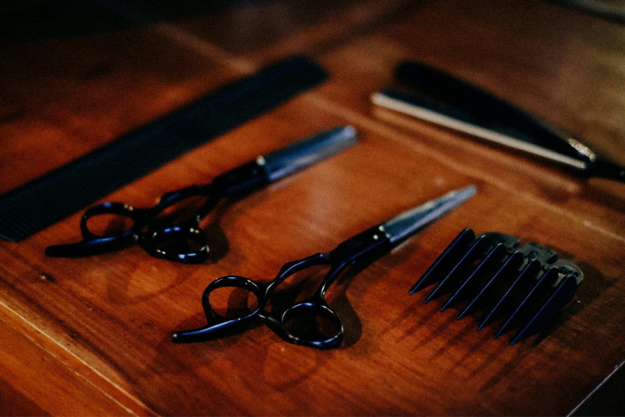 hair clippers on a wood table