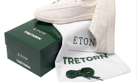 white eton x tretorn tennis sneaker on top of shoe box