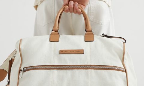 man holding travel bag