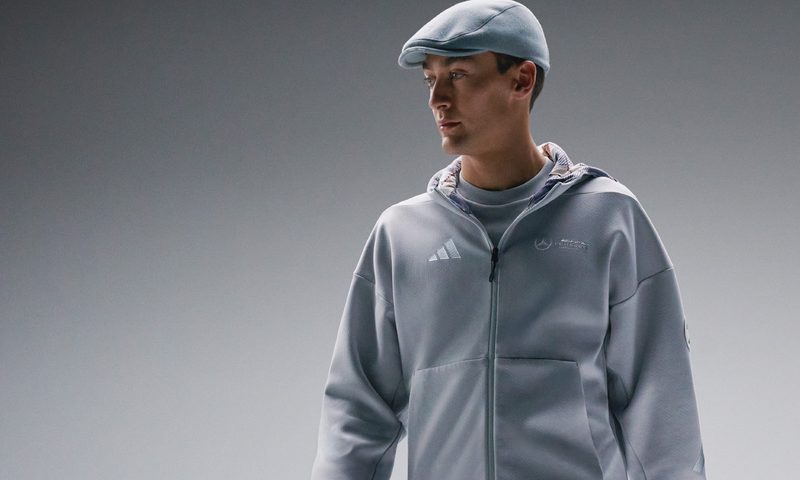 F1 driver George Russell wearing Adidas Mercedes fan wear.
