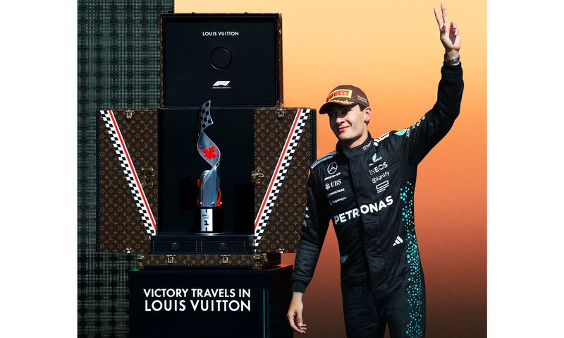 George Russell receiving the Montreal Grand Prix winner's trophy in a Louis Vuitton case.