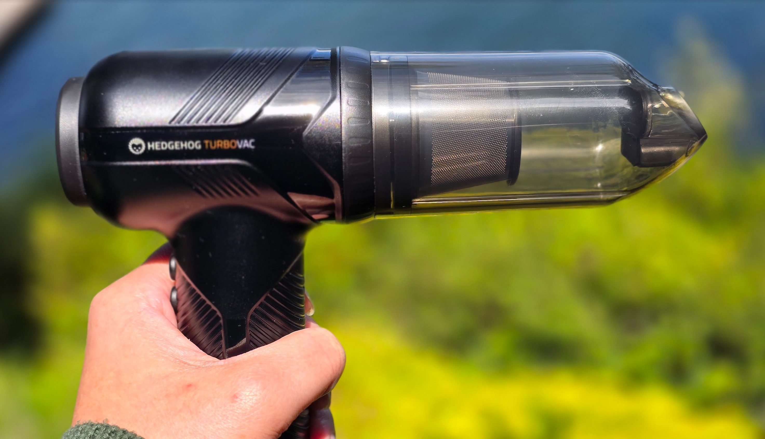 Side view of the Hedgehog TurboVac gripped by a hand