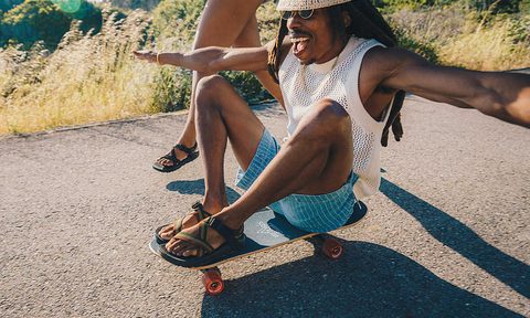 man on skateboard wearing chaco bob marley