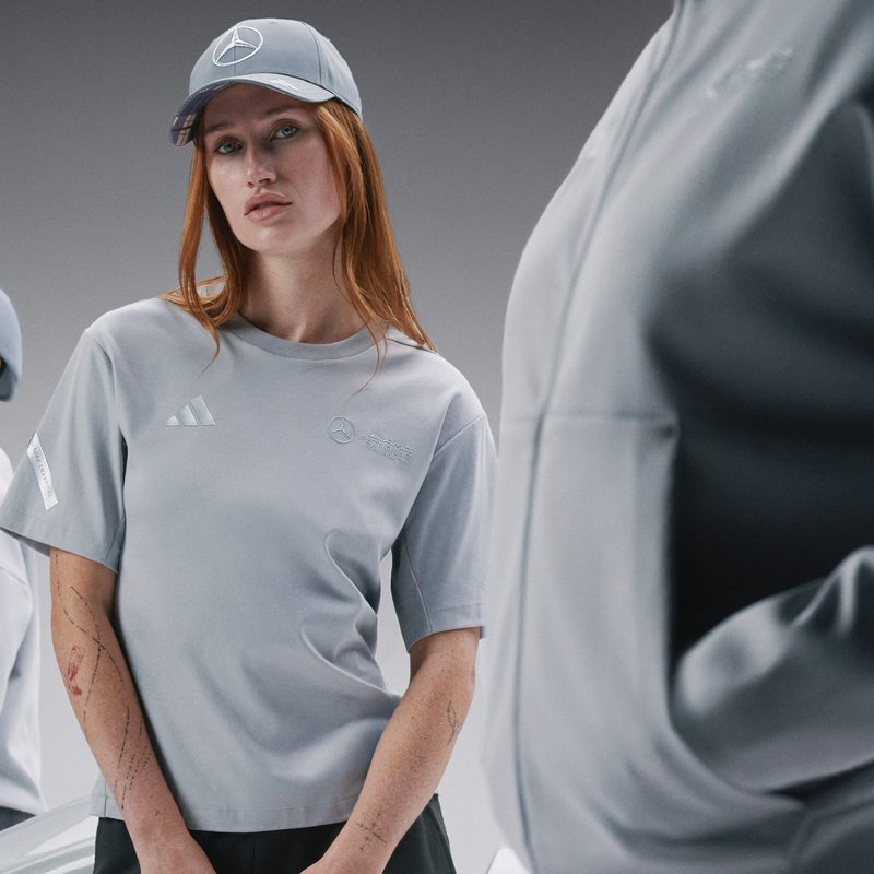 Three models wearing Adidas Mercedes teamwear.